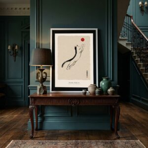 The Leap Sumi-e cat print framed in a room